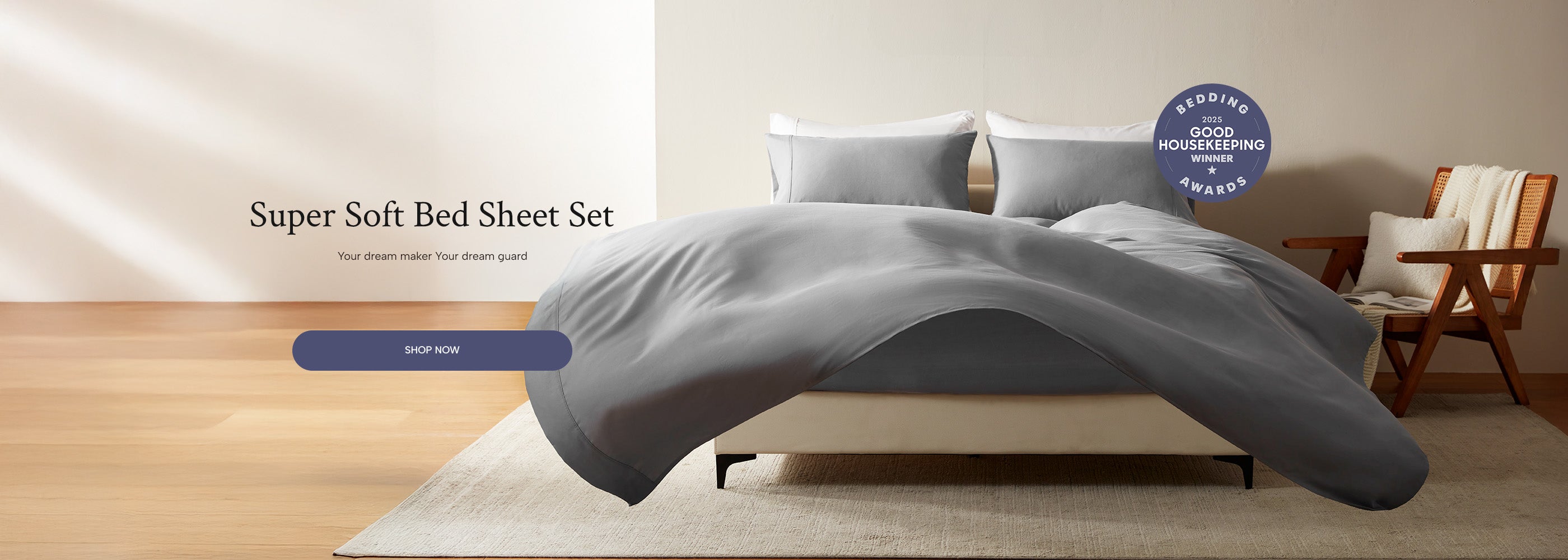 Gray bed sheet set on a bed with a chair and table in the background, featuring a 'Super Soft' label.