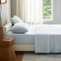 Beige European linen sheet set styled on a modern bed