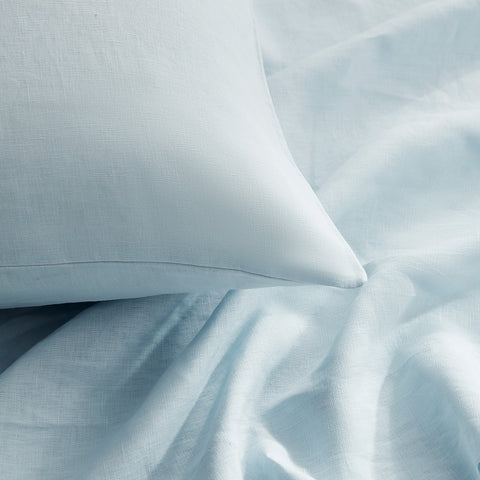 Close-up of blue European linen sheet and pillowcase fabric