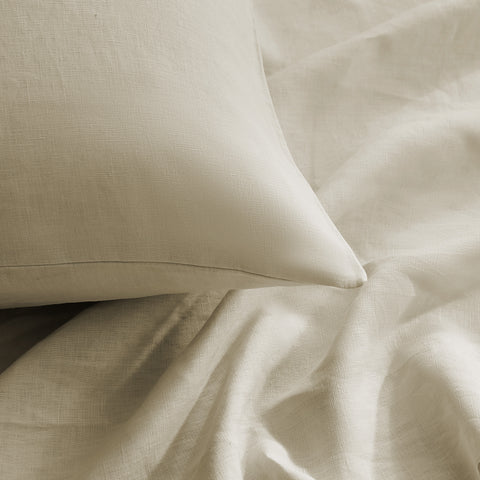 Close-up of beige European linen sheet and pillowcase fabric