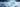 Ice cube on a textured white surface with a blue gradient background with text on the left saying: fabrics responds immediatedly on contact for a cool-to-the-touch feel