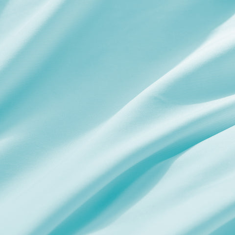Close-up of textured blue fabric with folds
