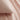 blush cotton jersey pillowcase close-up, showing soft texture and smooth fabric on a bed
