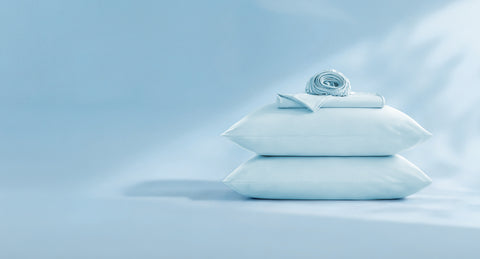Stack of cooling sheet set on a light blue background