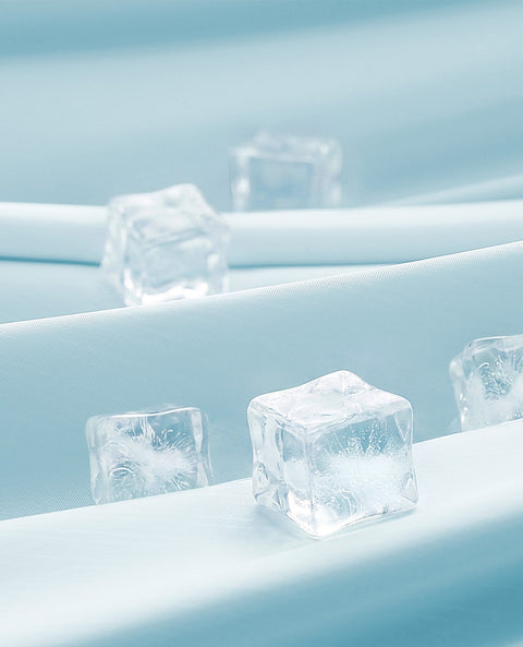Ice cubes on a light blue cooling tech fabrics
