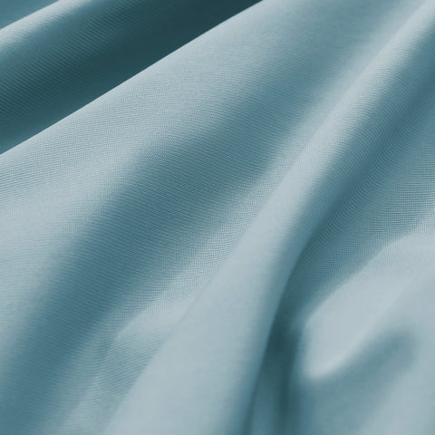 Close-up of textured blue fabric with folds