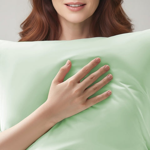 Person holding a cooling green pillow with a soft texture
