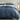 midnight cotton duvet cover set on a bed with a wooden nightstand and decorative items.
