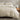 oyster cotton duvet cover set on a bed with a wooden nightstand and decorative items.
