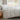 long side view of white cotton duvet cover set on a bed in a room with a window showing a garden view