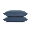 Two midnight pillows stacked on a midnight background
