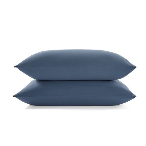 Two midnight pillows stacked on a midnight background
