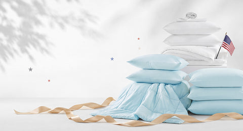 Stack of light blue and white cooling bedding products on a white background with an American flag. 