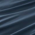 Close-up of a midnight cotton jersey pillowcase, emphasizing smooth, breathable texture for comfortable sleep
