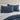 a close-up view of midnight cotton jersey pillowcase set on a midnight bed against a neutral wall.
