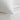 white cotton jersey pillowcase close-up, showing soft texture and smooth fabric on a bed